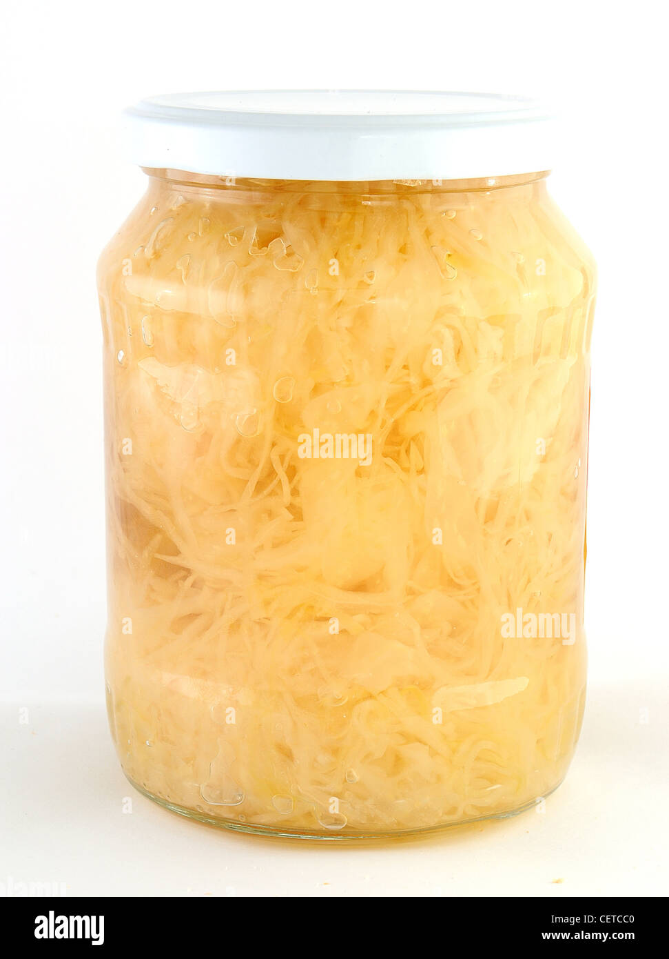Cabbage jamed to the jar with white lid. Stock Photo