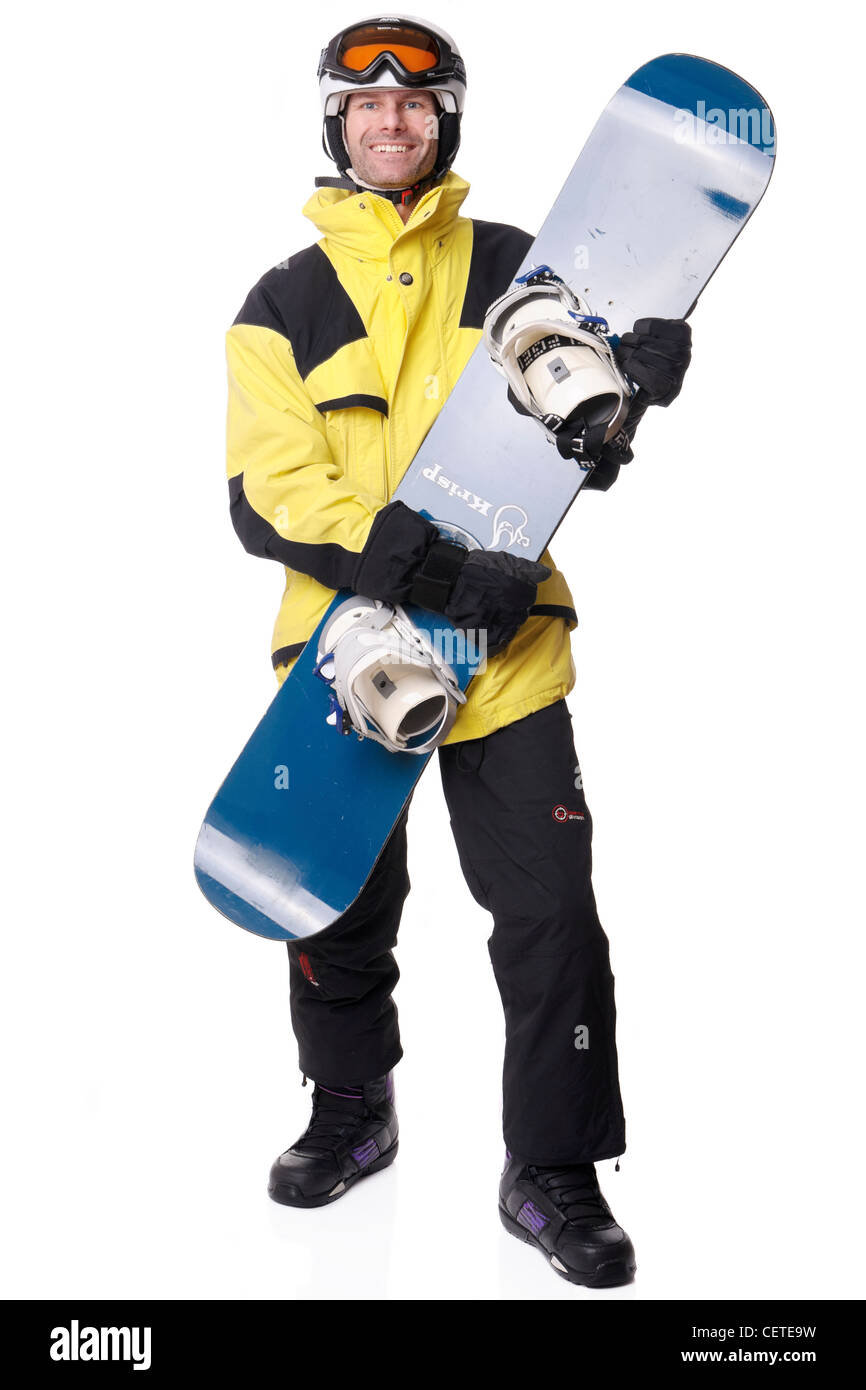 Young man with snowboard in front of white background Stock Photo - Alamy