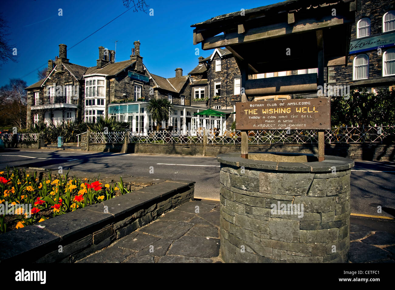 An old wishing well and buildings near Lake Windemere. Stock Photo