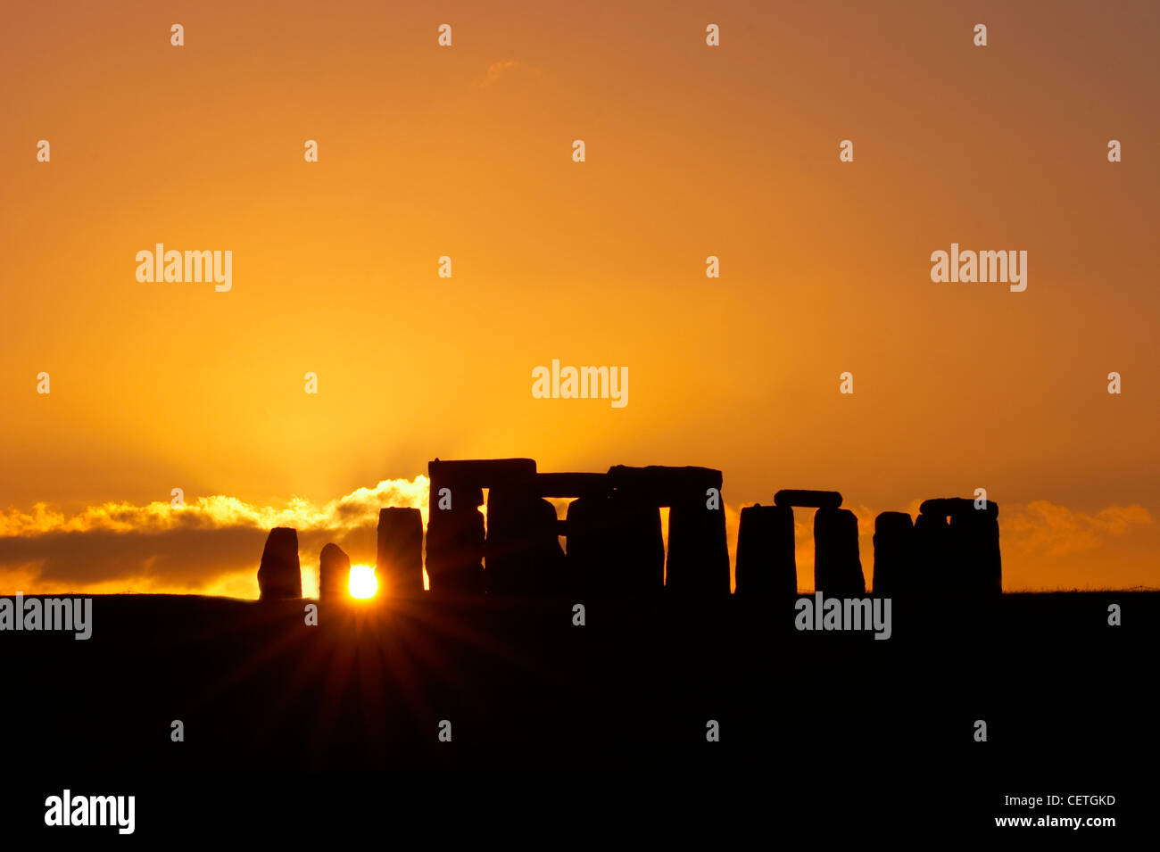 Stonehenge at sunset. Built around 3100 BC, it has been estimated that the three phases of the construction required more than t Stock Photo
