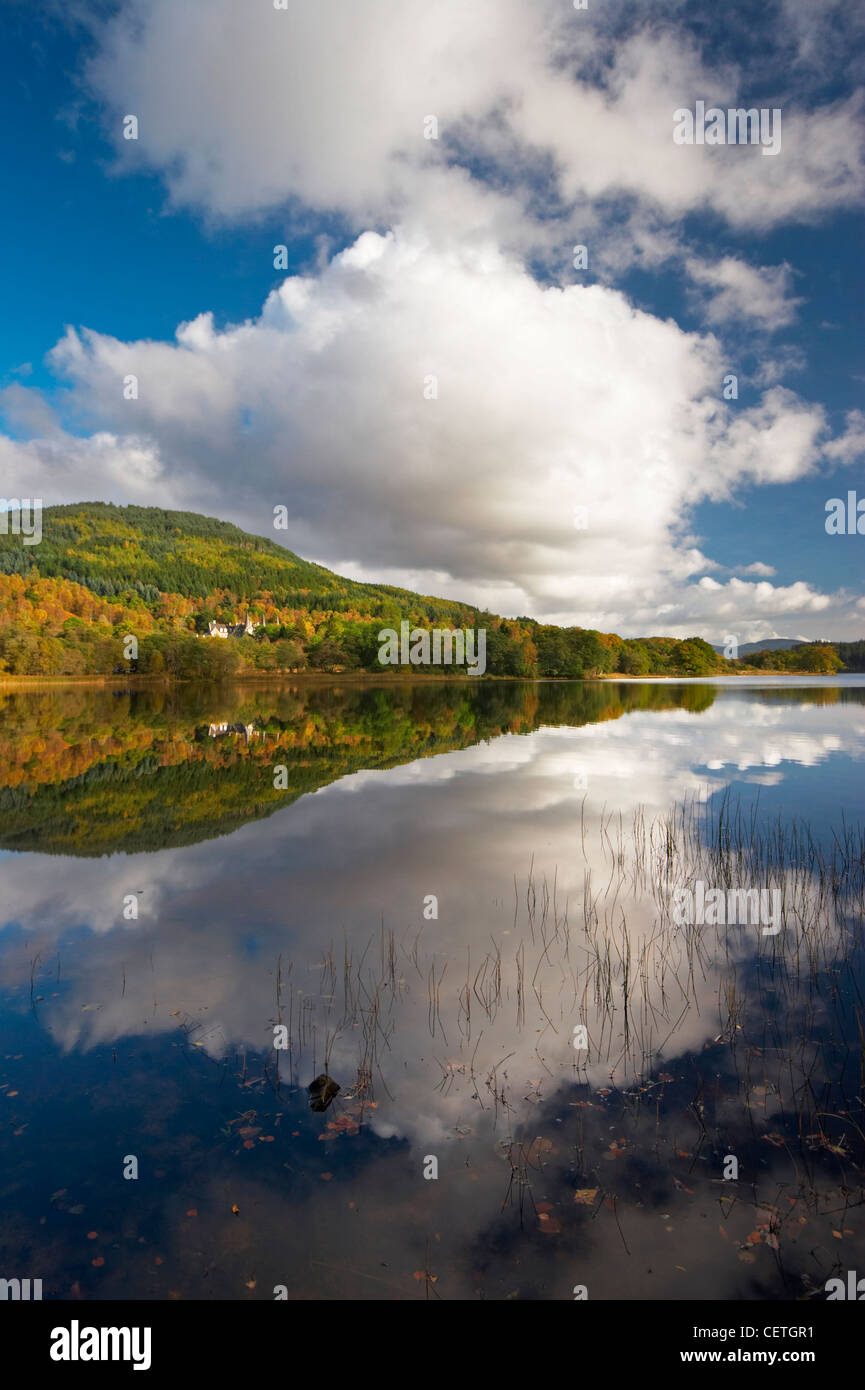 Loch Achray Reflections. It lies between Loch Venachar and Loch Katrine, 7 miles (11 km) west of Callander and has a surface are Stock Photo