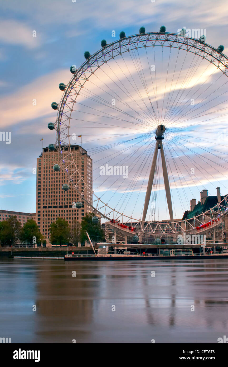 London Eye at Sunrise. The British Airways London Eye is the world's tallest observation wheel at 135m high. Stock Photo