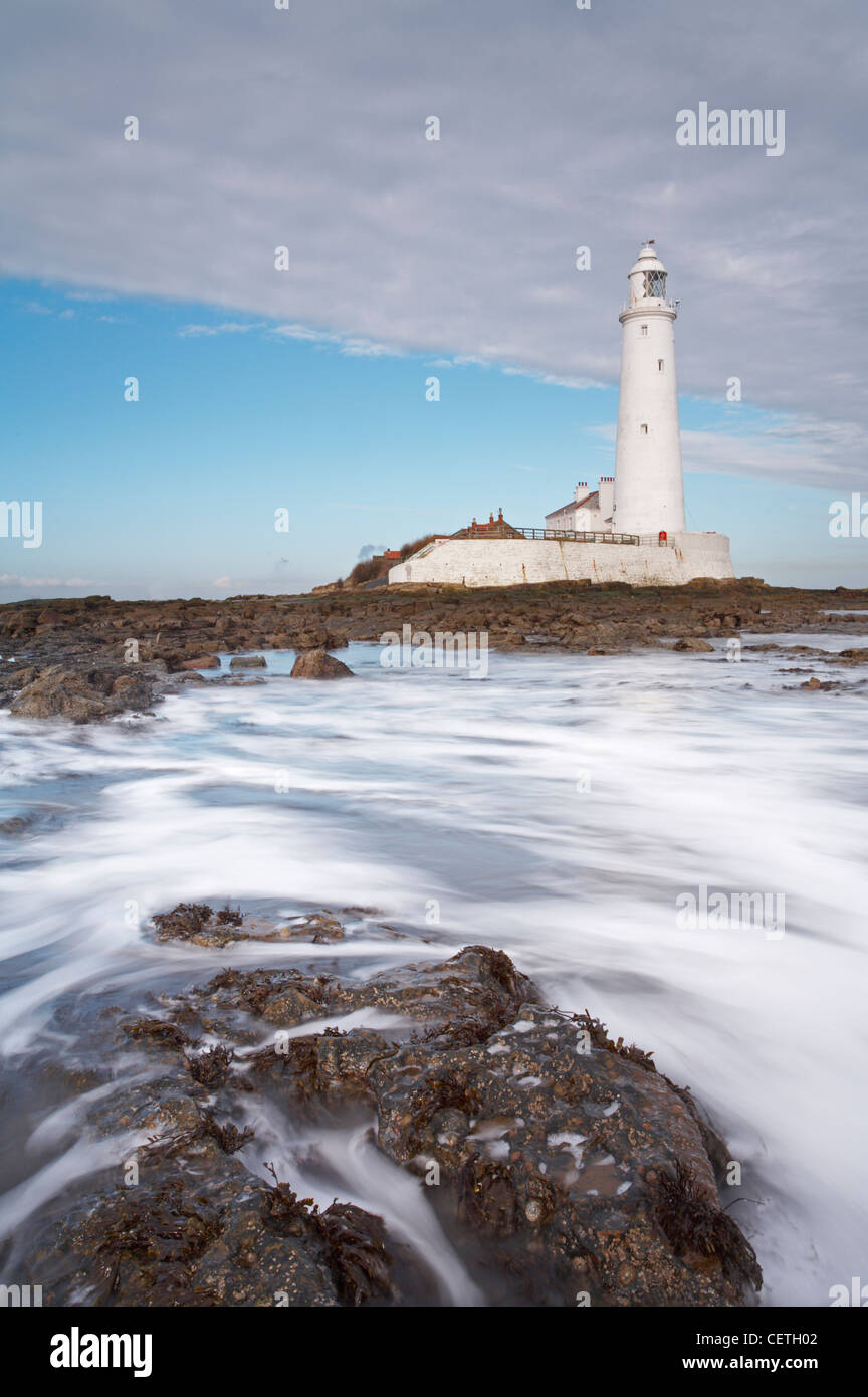 St Mary's lighthouse at low tide. The lighthouse is situated on St Mary's Island north of Whitely Bay. Stock Photo