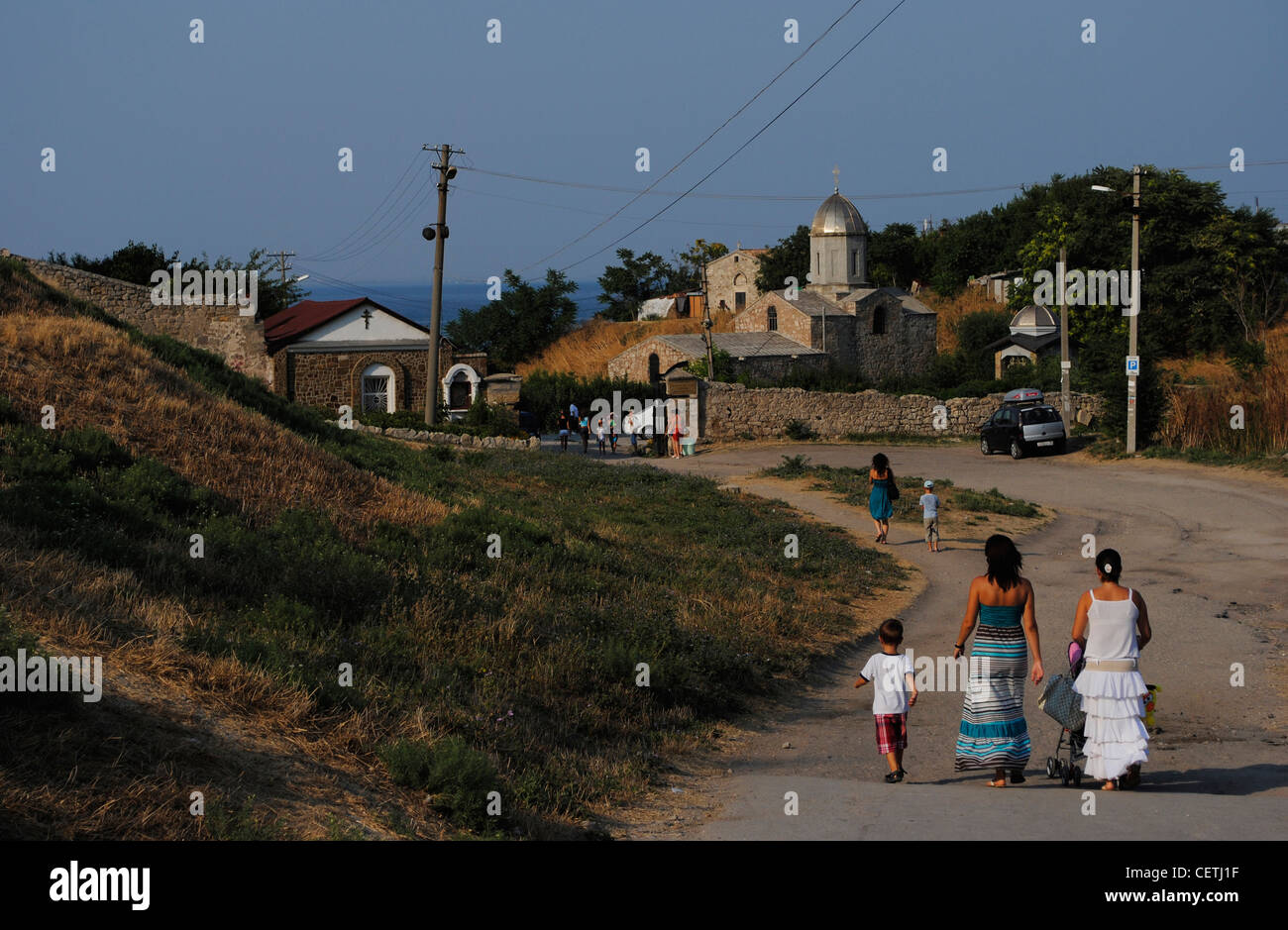 Ukraine. Autonomous Republic of Crimea. Feodosiya. People walking down a road. Stock Photo