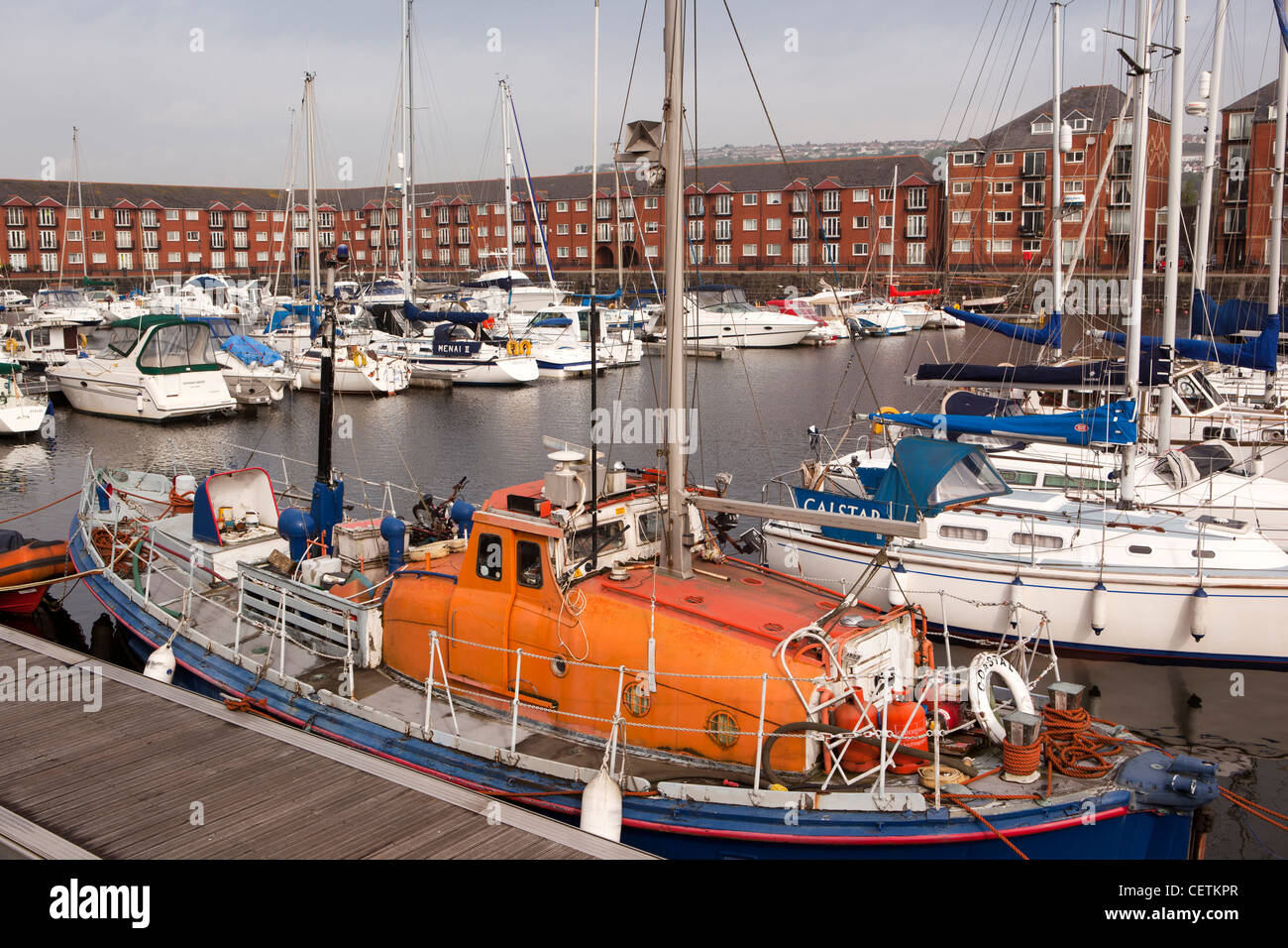UK, Wales, Swansea, Maritime Quarter, Marina, former lifeboat moored amongst pontoons Stock Photo