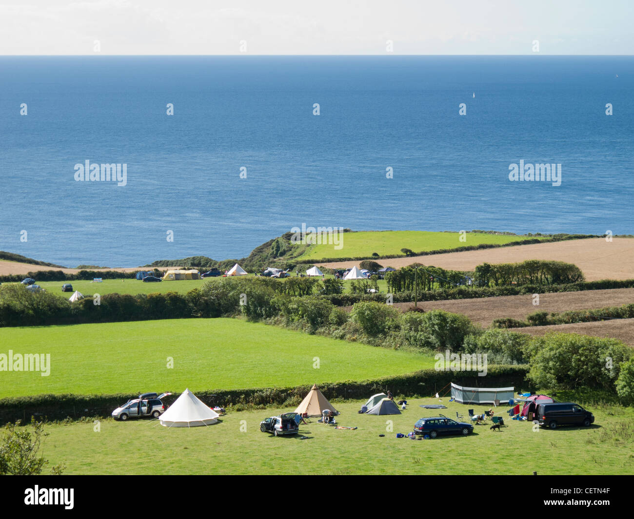 Camping field at the edge of the sea in East Prawle, Devon Stock Photo