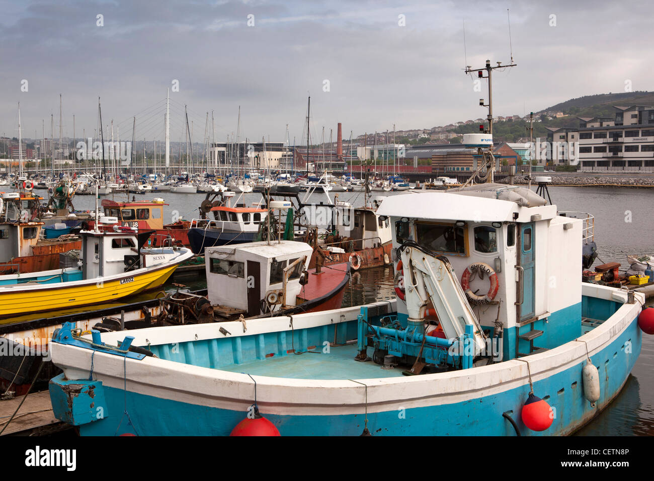 UK, Wales, Swansea, Maritime Quarter, fishing boats moored on River Tawe below sailbridge Stock Photo