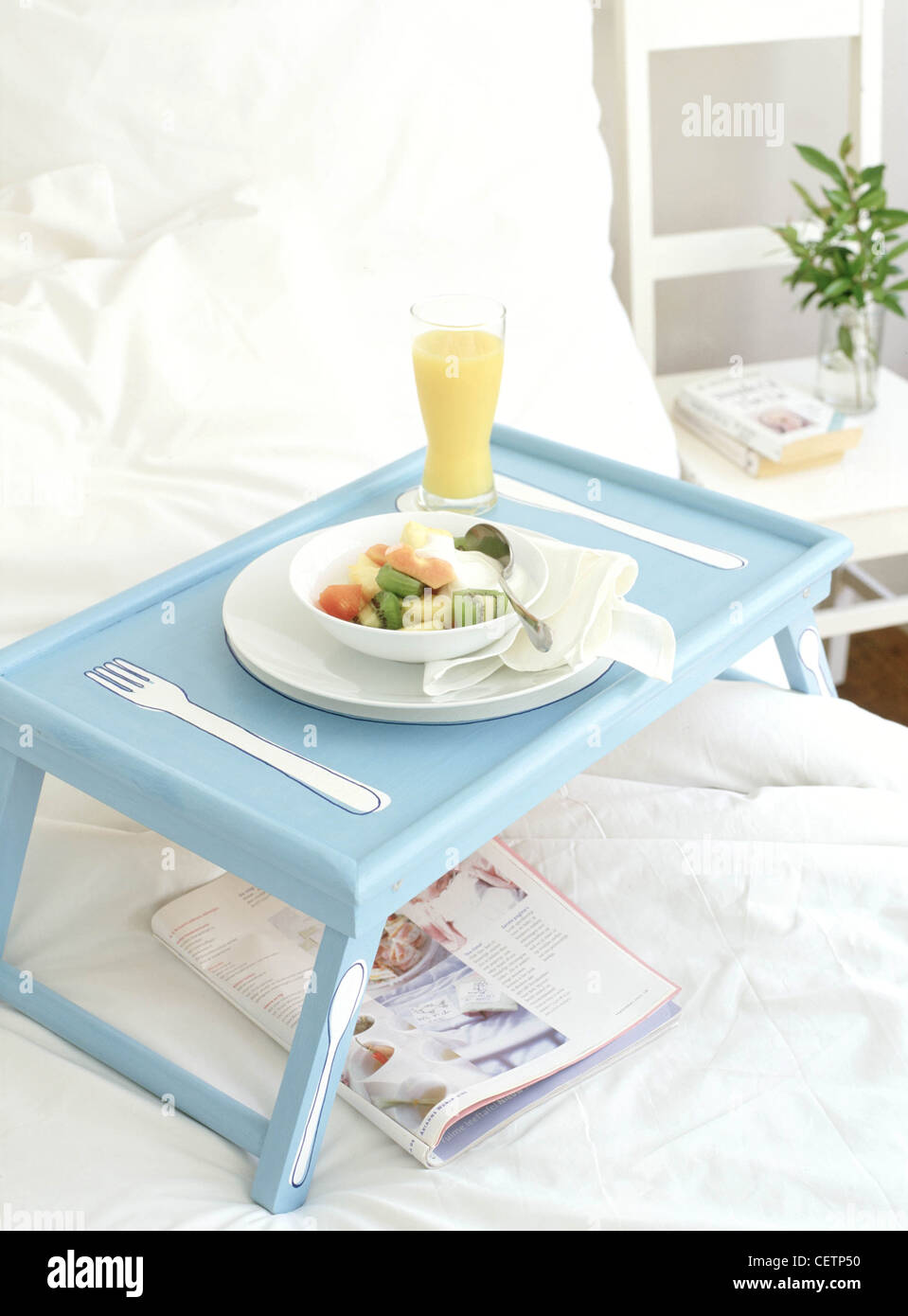 Blue and white bed tray outline of plate and cutlery design holding
