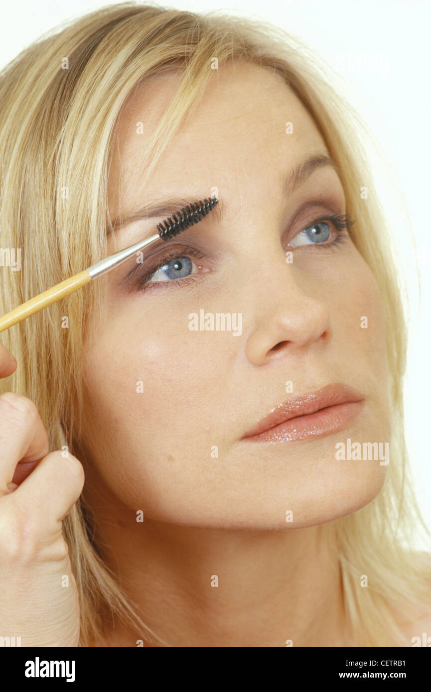 Close Up Of Female Shoulder Length Blonde Hair Wearing Brown Stock
