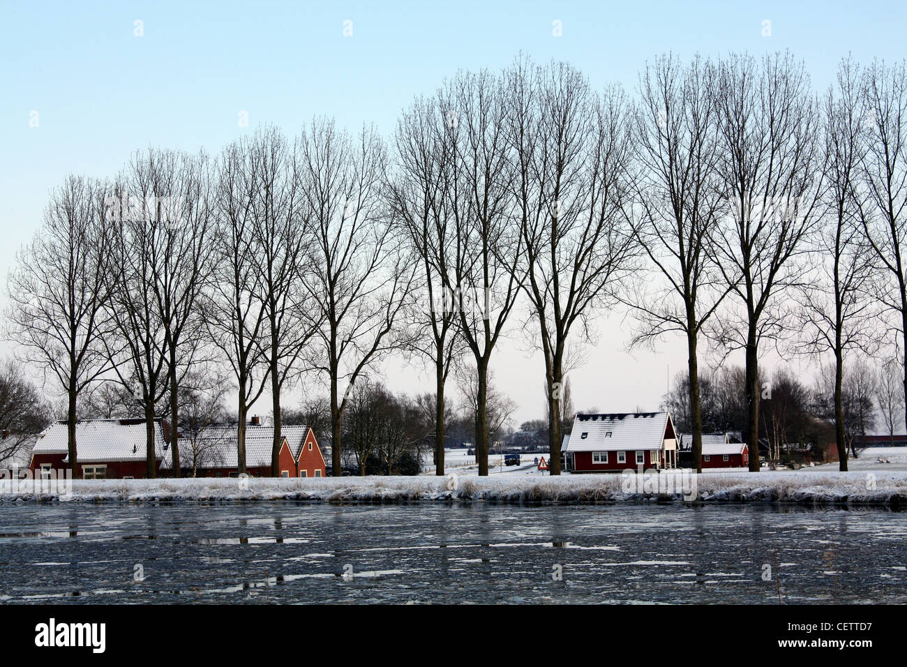 Houses on the Eemscanal with ice floes in Woltersum. The Netherlands Stock Photo