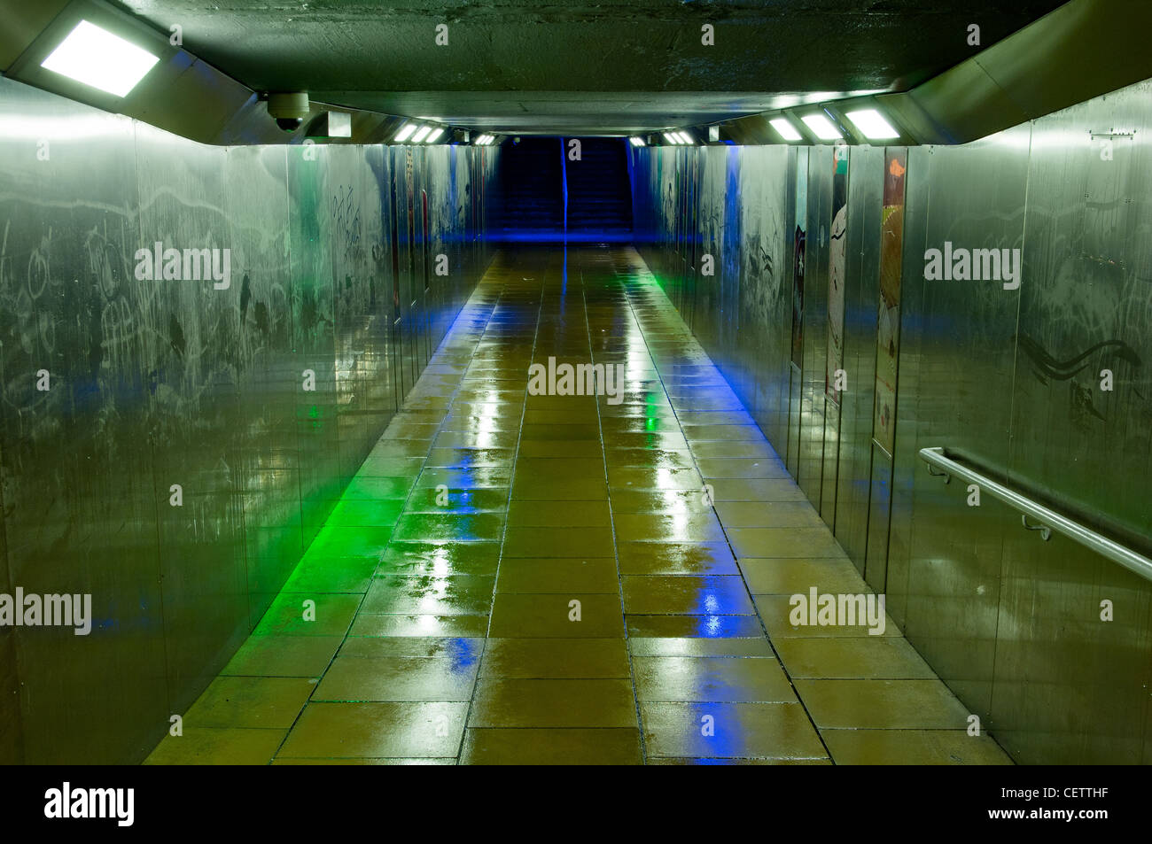 metal-clad-underpass-with-neon-lights-in-the-rain-at-night-CETTHF.jpg