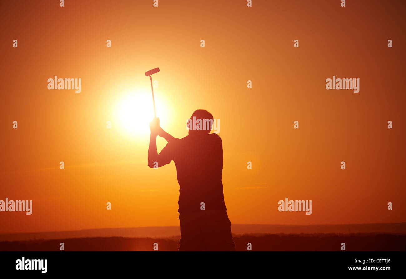 man play golf on sunset,selective focus on head Stock Photo