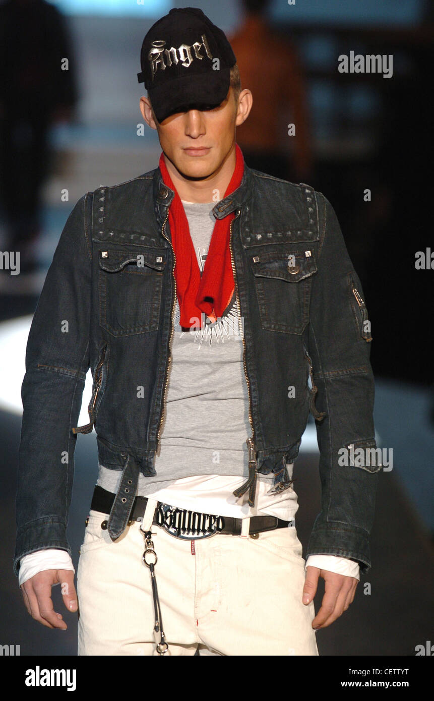 D Milan Menswear Ready to Wear Autumn Winter Cropped denim jacket, trucker cap, white jeans and red scarf Stock Photo