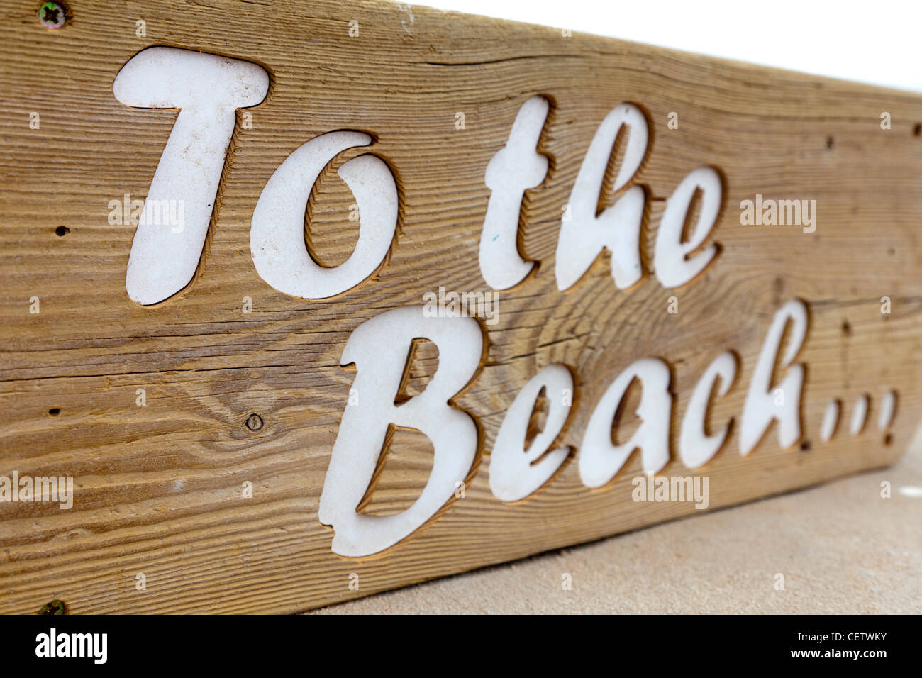 Wooden sign to the beach Stock Photo - Alamy