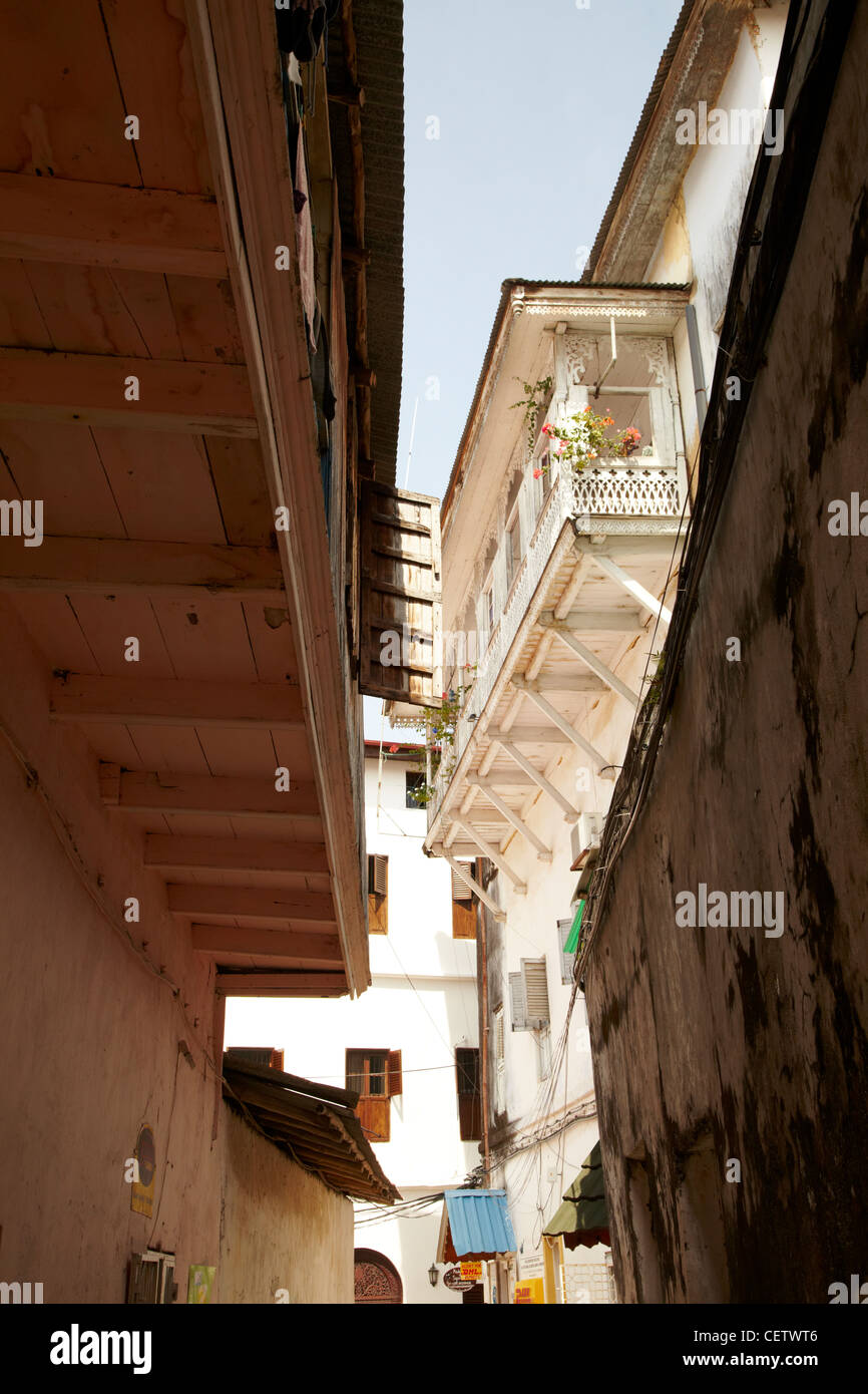 Zanzibar narrow street with verandas almost touching Stock Photo