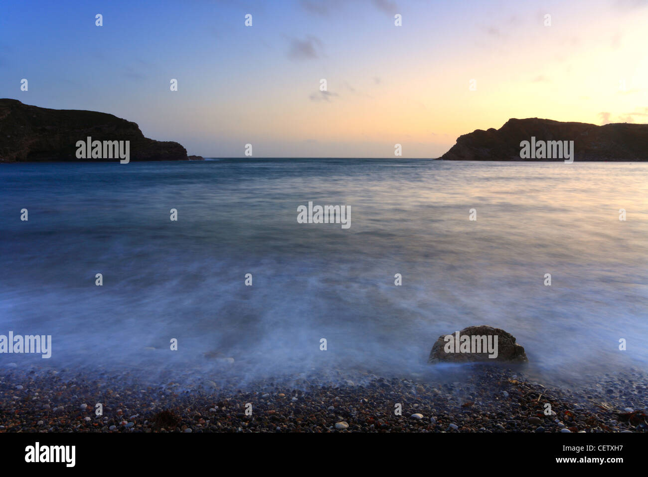 Lulworth Cove Dorset, England UK, looking out to sea, sunset. Stock Photo