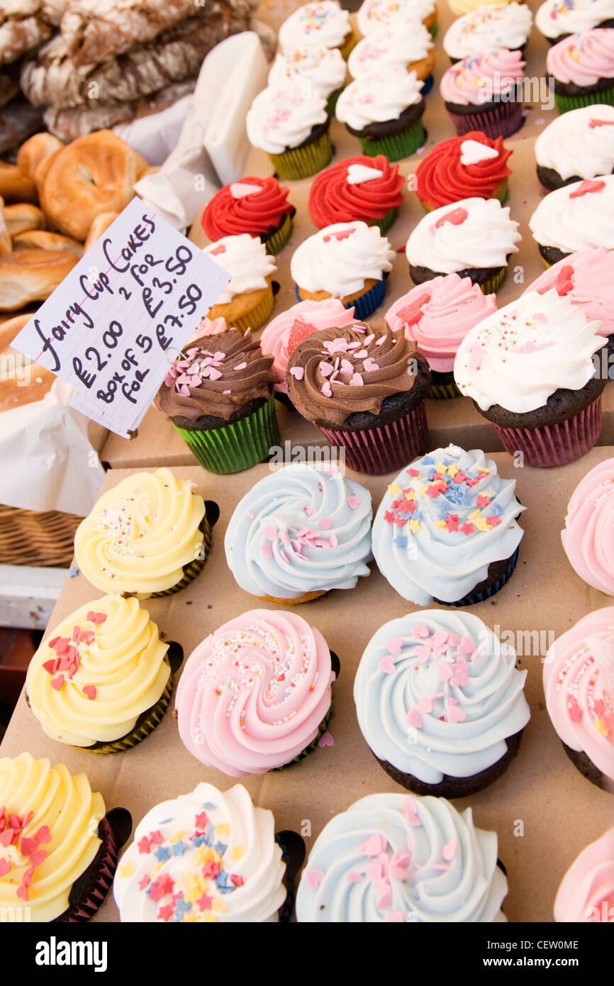 Portobello Road Street Market , London , assorted multicoloured multicolored fairy cup cakes cup cakes on bakery stall price label Stock Photo