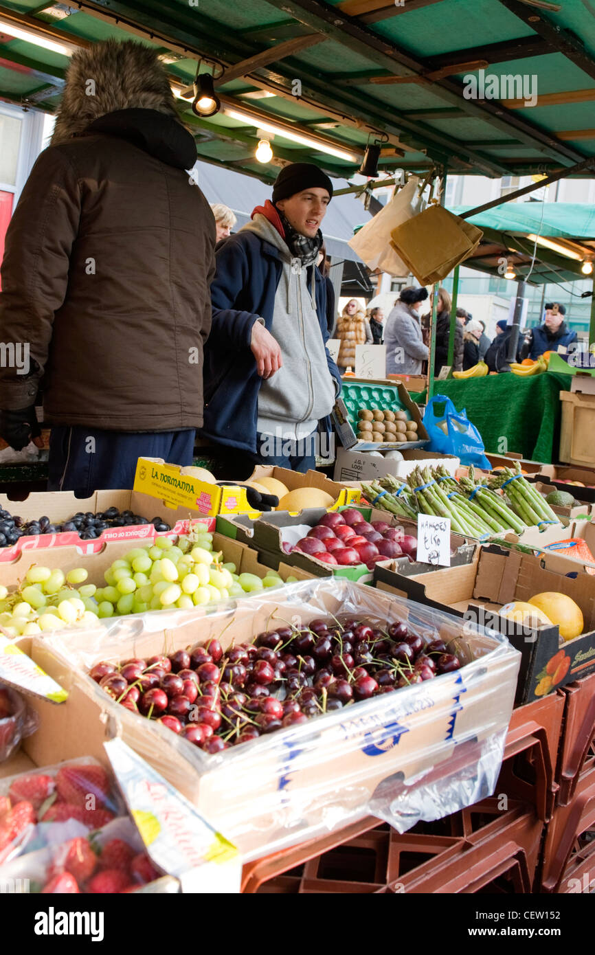 Portobello Road Street Market , London , greengrocer fruitier young man