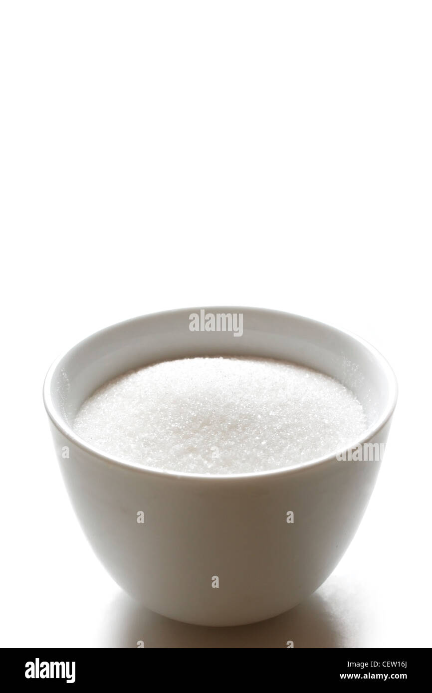 Sugar in a bowl isolated on white Stock Photo