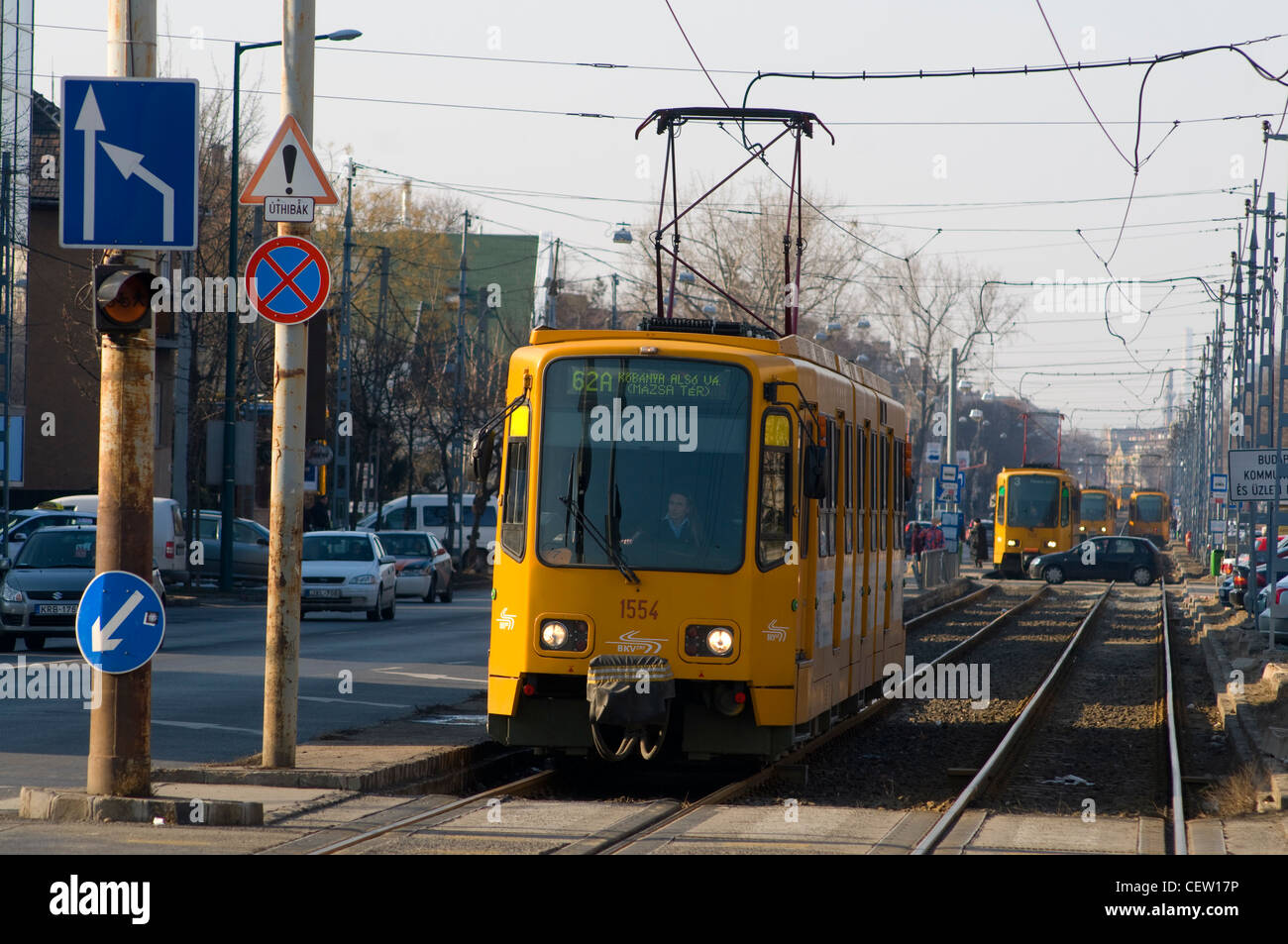 Trams at rush hour lining up.  Traffic crossing. Stock Photo