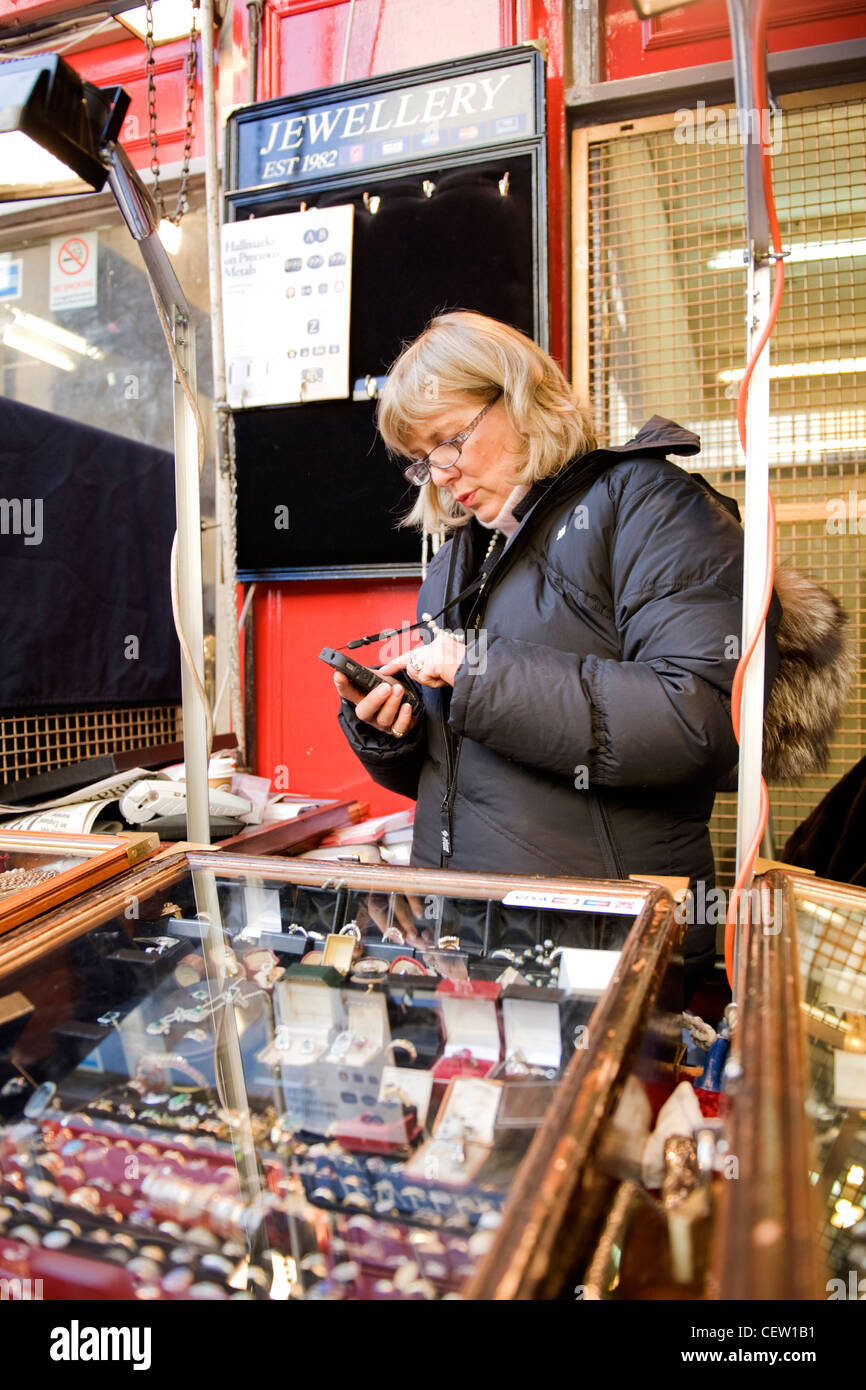 Portobello Road Street Market London blond female lady woman vendor on
