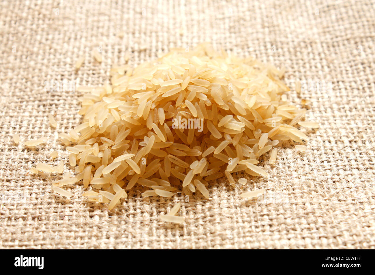 Parboiled rice on a texture background Stock Photo - Alamy