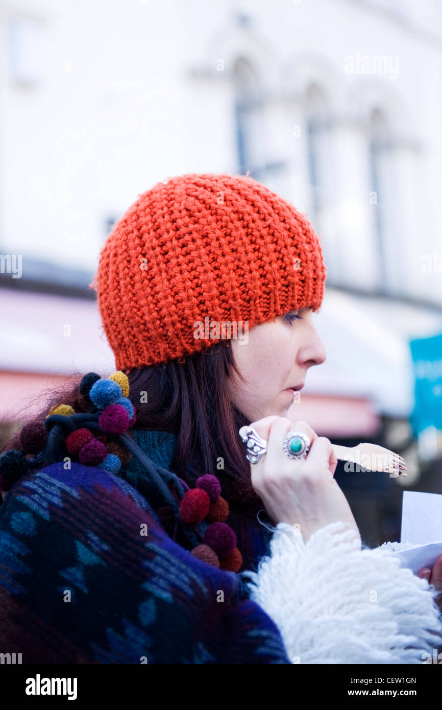Portobello Road Street Market London pretty young girl red woolly hat winter coat rings