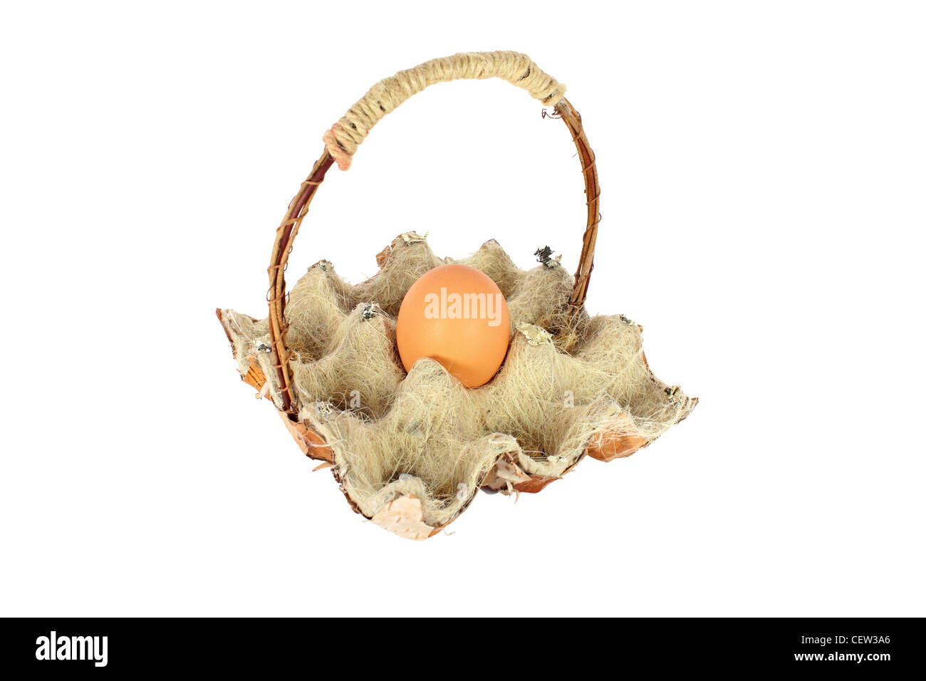 Chicken egg in a basket made of natural materials, isolated Stock Photo