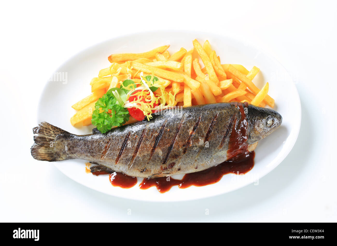 Grilled trout and French fries with barbecue sauce Stock Photo Alamy