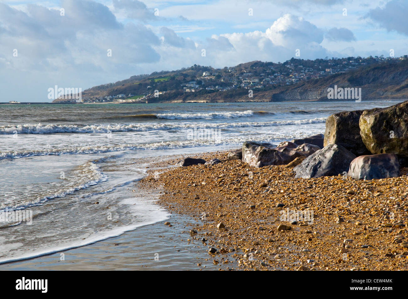 Charmouth beach on the jurassic coast at Charmouth, Dorset, UK taken on sunny day in winter with Lyme Regis in the distance Stock Photo