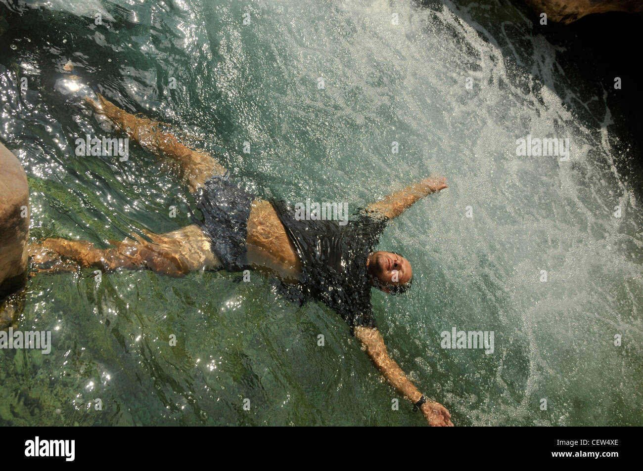 Bathing With Rocks hiker bathing in natural rock pool Stock Photo - Alamy