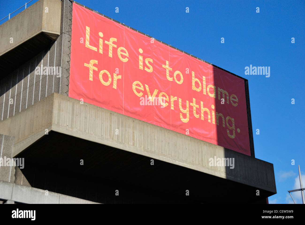 A large banner reading: ‘ Life is to blame for everything ‘ Stock Photo