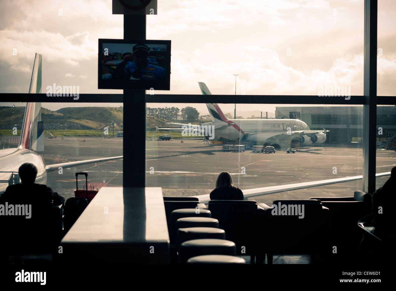 People waiting inside Auckland International Airport, Auckland, New Zealand. Stock Photo