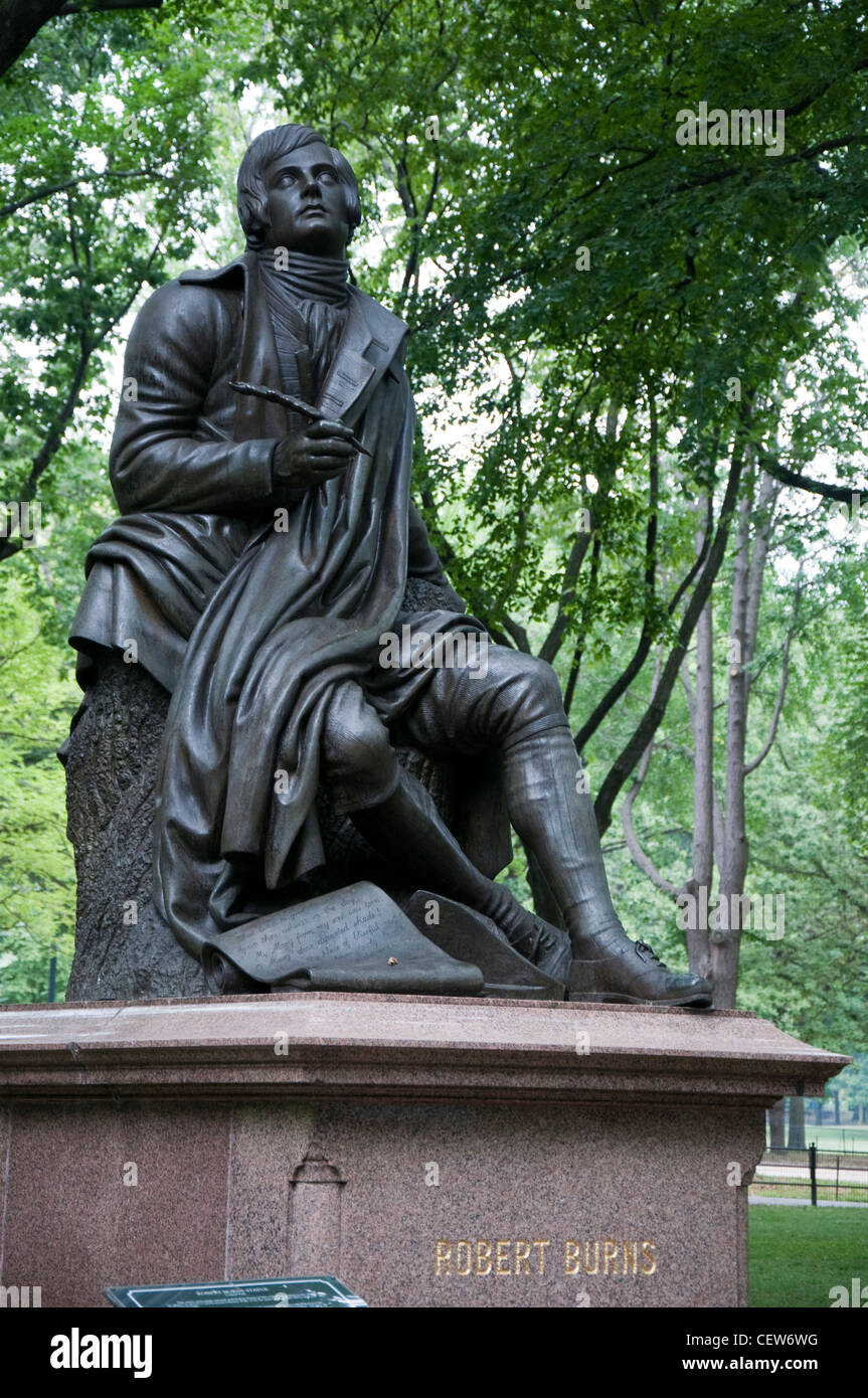 A bronze statue of Robert Burns (1759 - 1796) shaded by trees on the Mall in Central Park, New York City USA Stock Photo