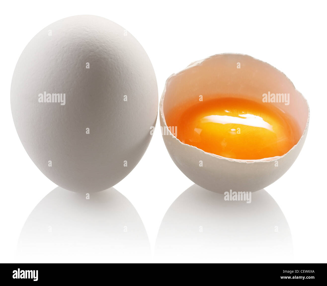 White egg and a half eggs on a white background Stock Photo Alamy