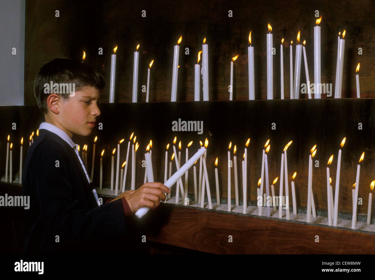boy lighting candles, altar, Palm Sunday, Holy Week, Annunciation