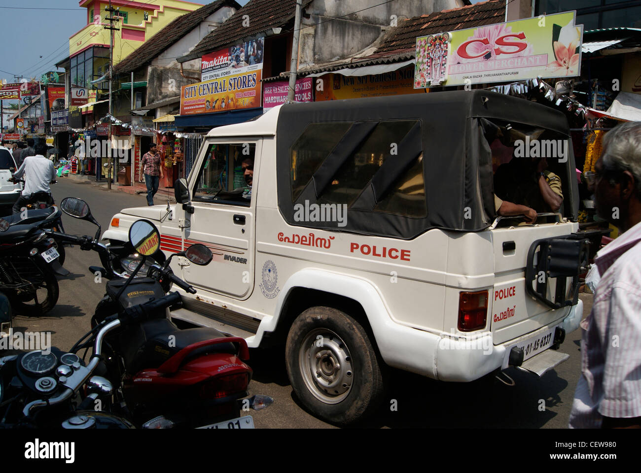 Police Jeep petrolling through the congested Chalai Bazaar market road in Trivandrum city,Kerala,India Stock Photo