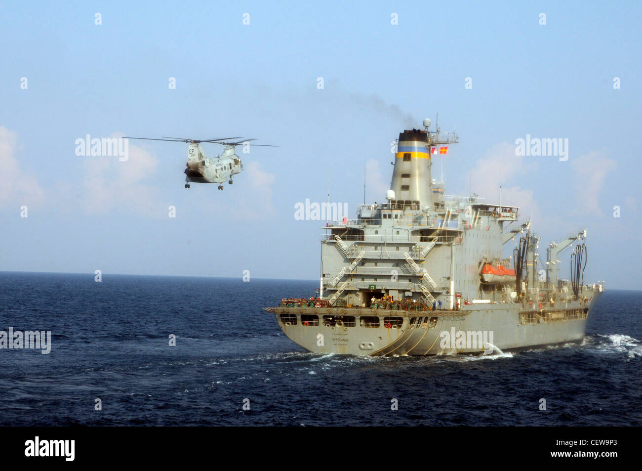 GULF OF THAILAND (Feb 20, 2012)- A CH-46 Sea Knight flies towards the USNS Tippecanoe (T-AO-199) during a replenishment at sea with the forward-deployed amphibious dock landing ship USS Germantown (LSD 42) and USS Tortuga (LSD 46). Germantown, with embarked elements of the 31st Marine Expeditionary Unit (31st MEU,) is currently underway after participating in Exercise Cobra Gold 2012, an annual Thai-U.S. co-sponsored joint and multinational exercise designed to advance security throughout the Asia-Pacific region and enhance interoperability with participating nations. Stock Photo