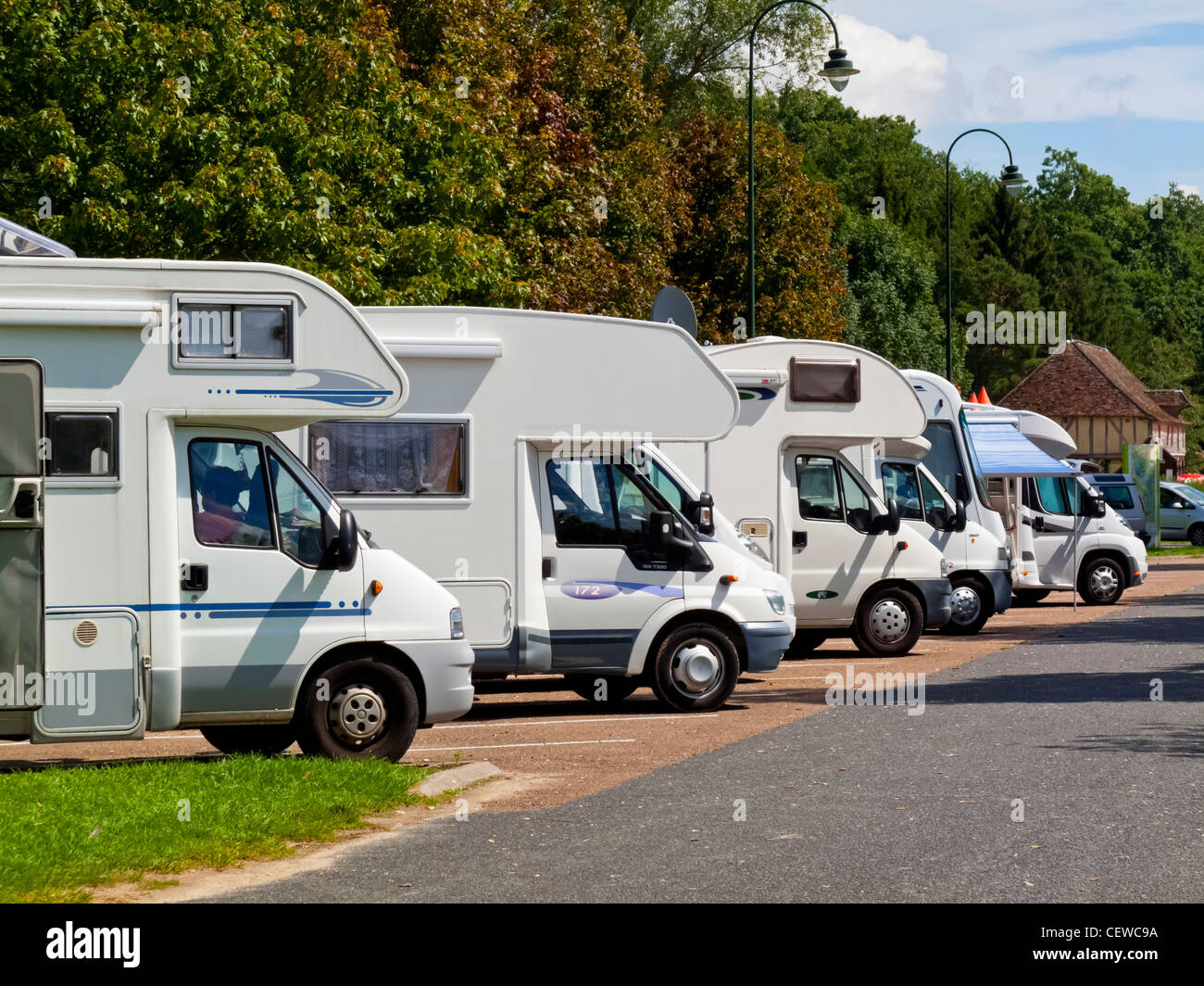 Group of motorhomes parked at a free overnight campsite or aire in at Geraudot in central France Stock Photo
