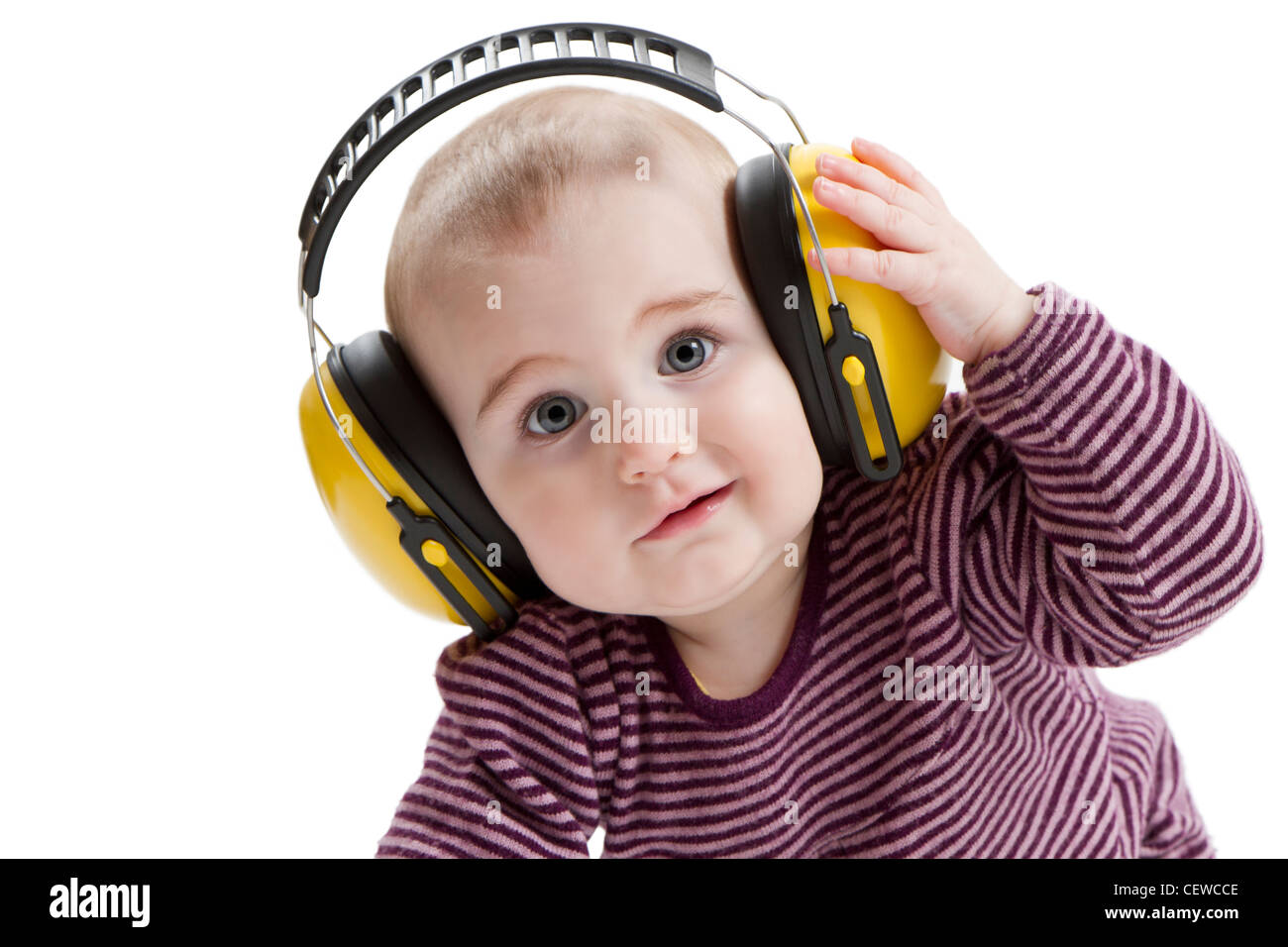 young child with yellow ear protector. not amused Stock Photo Alamy
