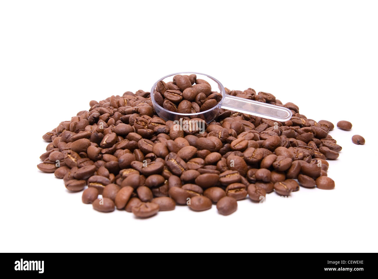 coffee beans with spoon on a white background Stock Photo - Alamy