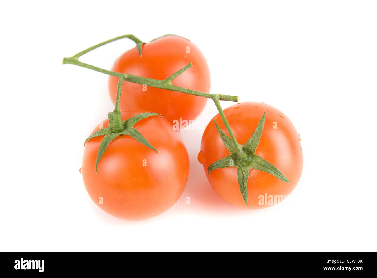 cherry tomatoes isolated on a white background Stock Photo - Alamy
