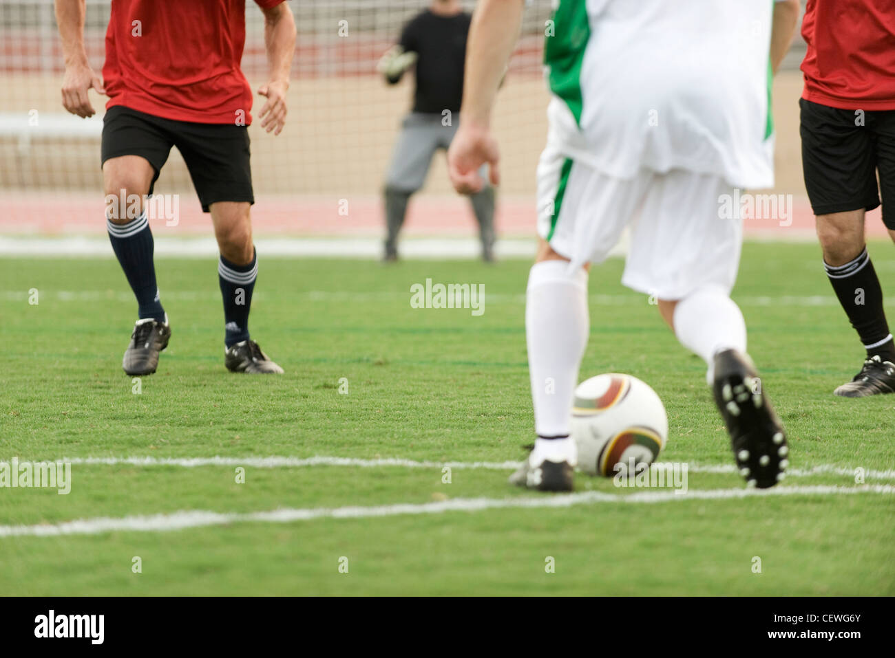 Soccer players on field, cropped Stock Photo Alamy