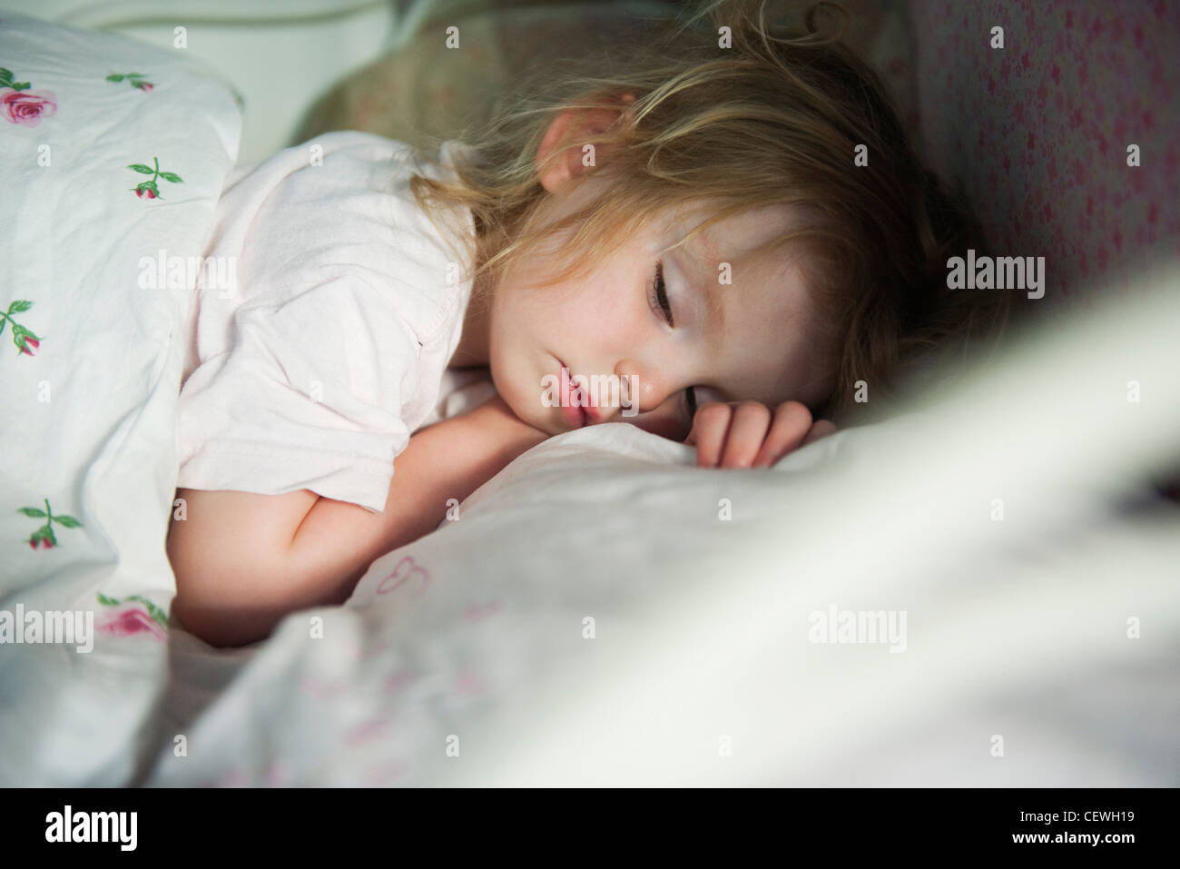 Toddler sleeping in bed Stock Photo Alamy