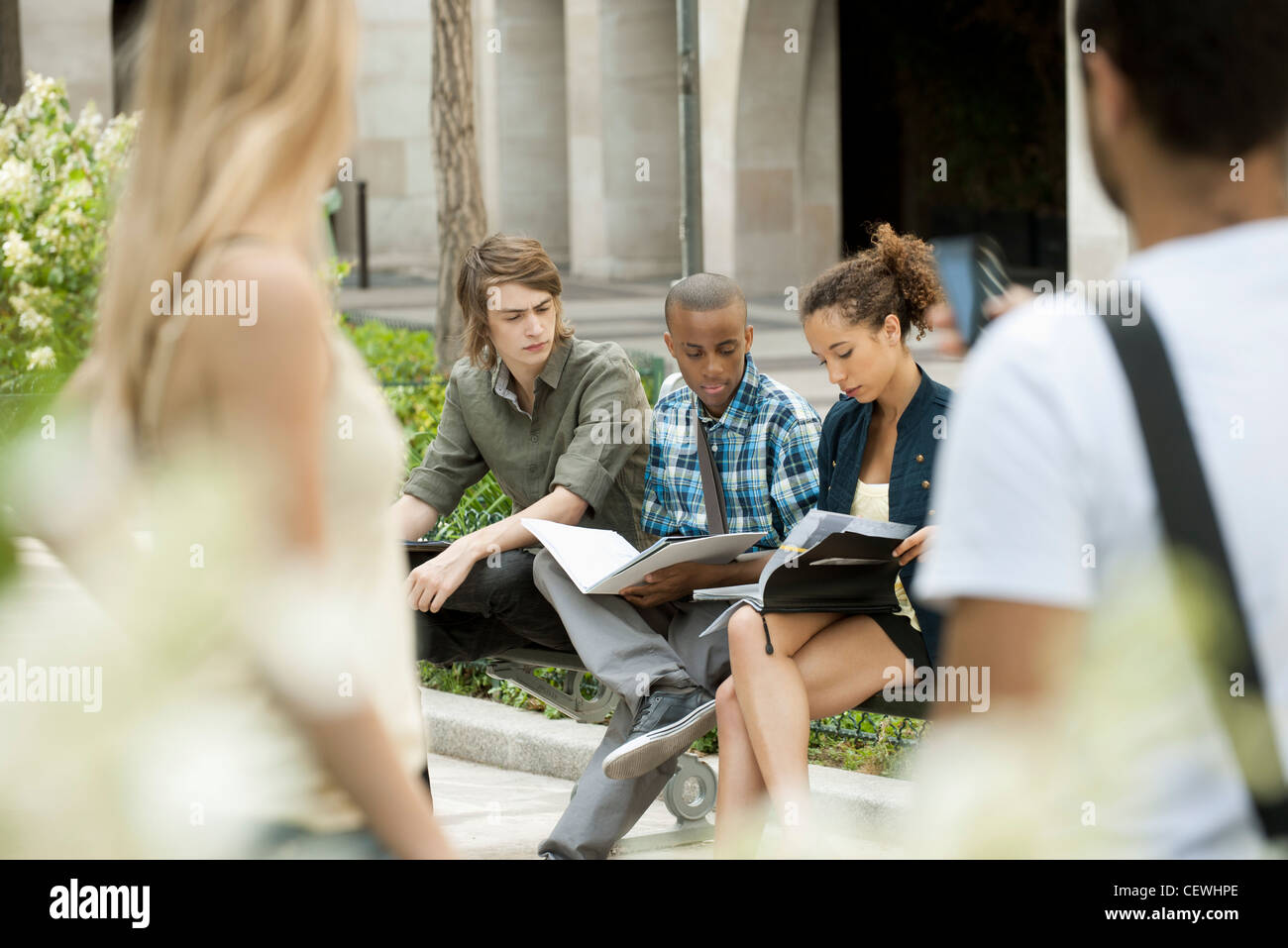 University students studying on campus, people in foreground Stock Photo