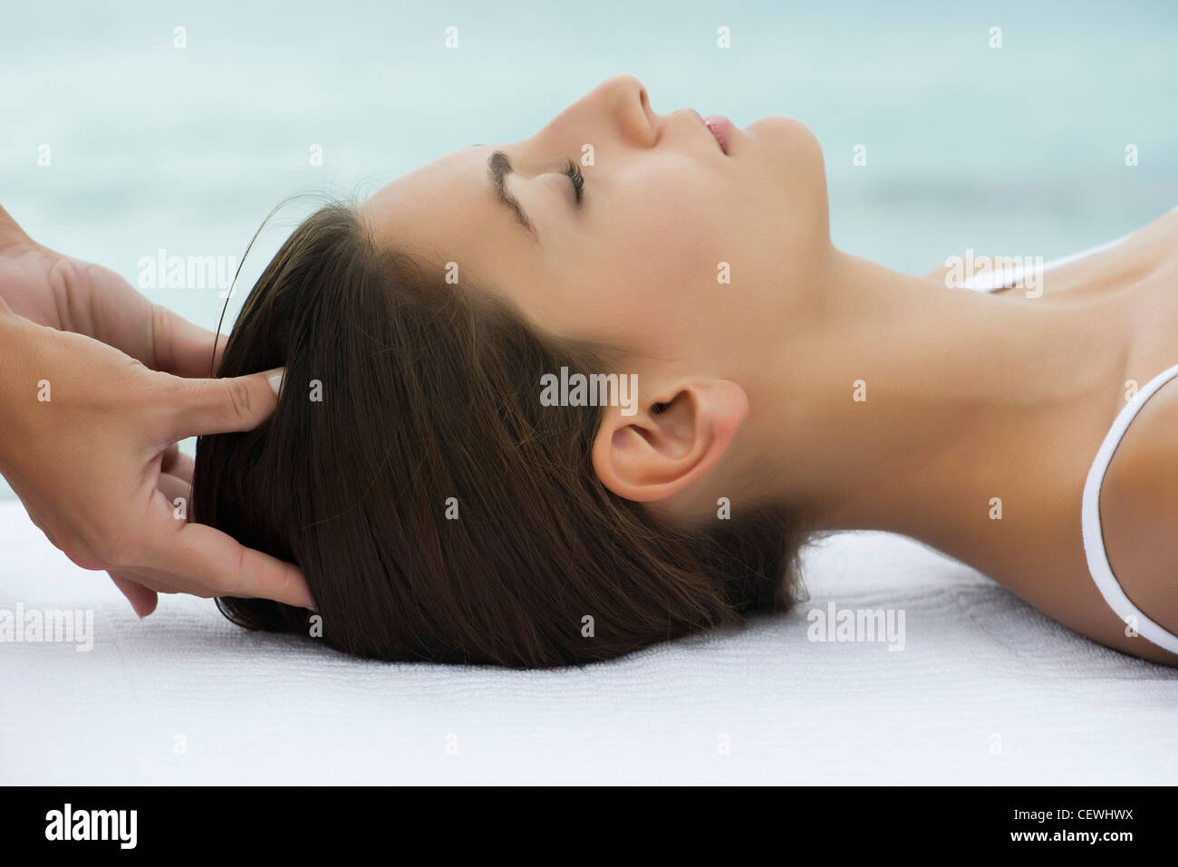 Young woman receiving head massage, side view Stock Photo Alamy
