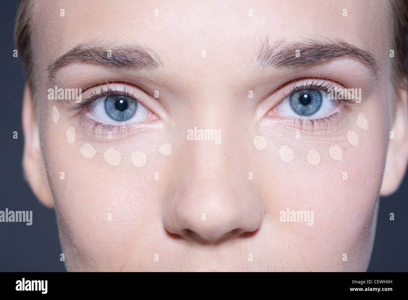 Step by Step Beauty and Make Up Female with concealer dots in the under