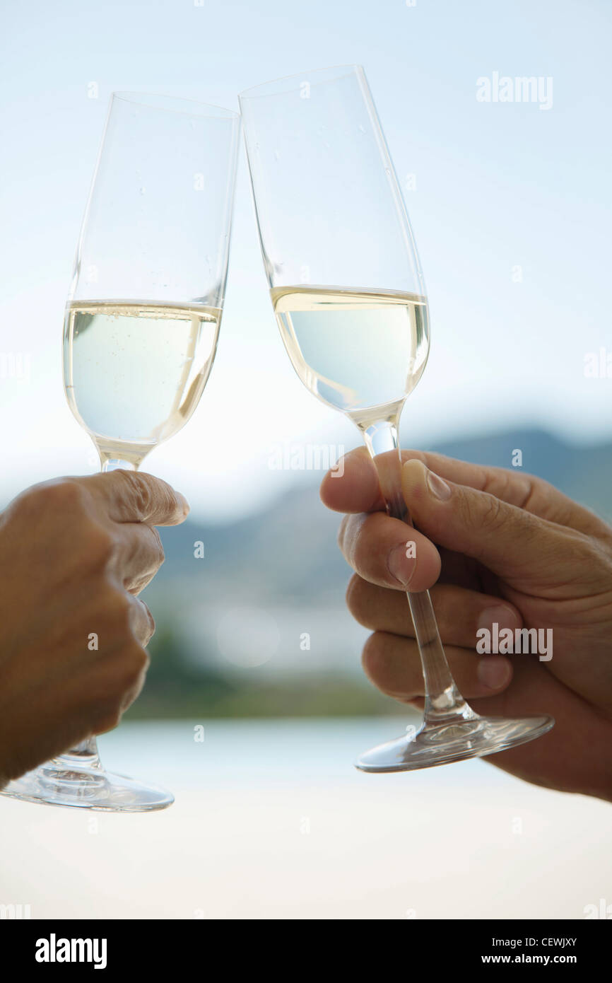 Clinking champagne glasses Stock Photo Alamy