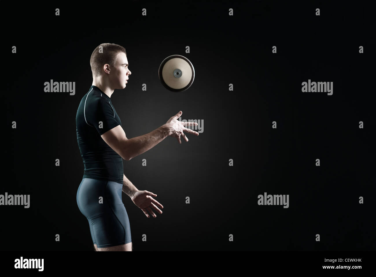 Male athlete throwing discus in air Stock Photo Alamy