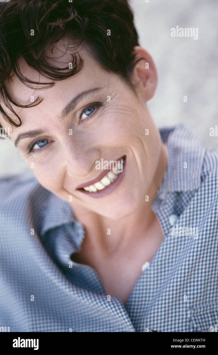 A Cropped Image Of Brunette Female Short Hair Wearing A Blue And